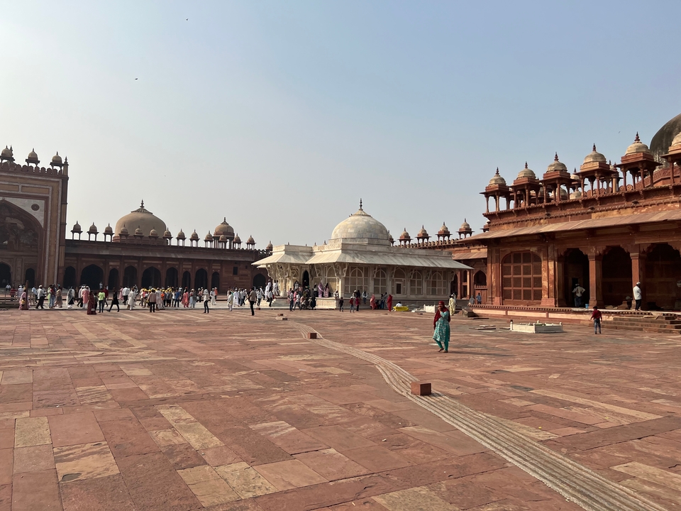 Courtyard of a historical site with visitors.