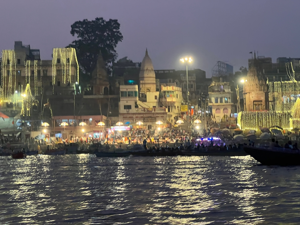 City lights along the river during an evening event.
