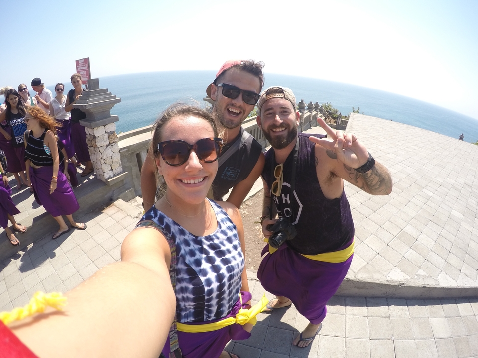 Group of friends taking a selfie at a coastal viewpoint