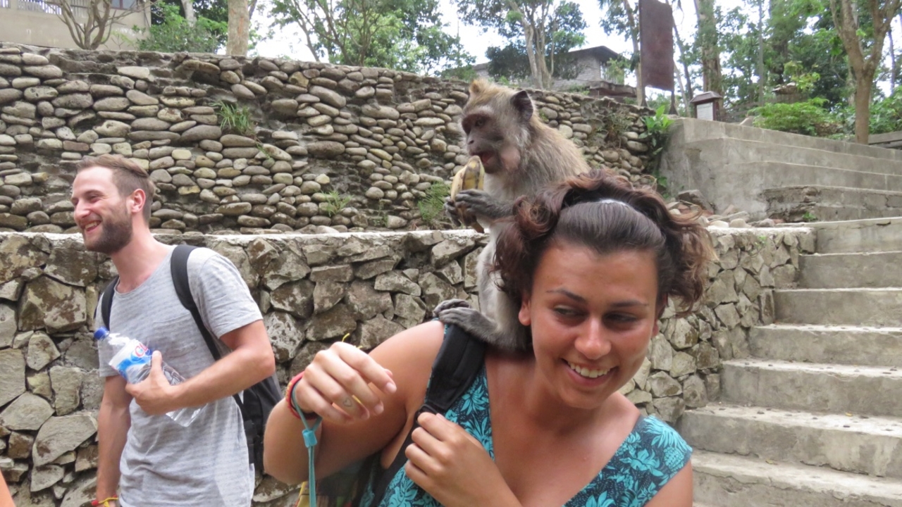 Woman with a monkey on her shoulder.