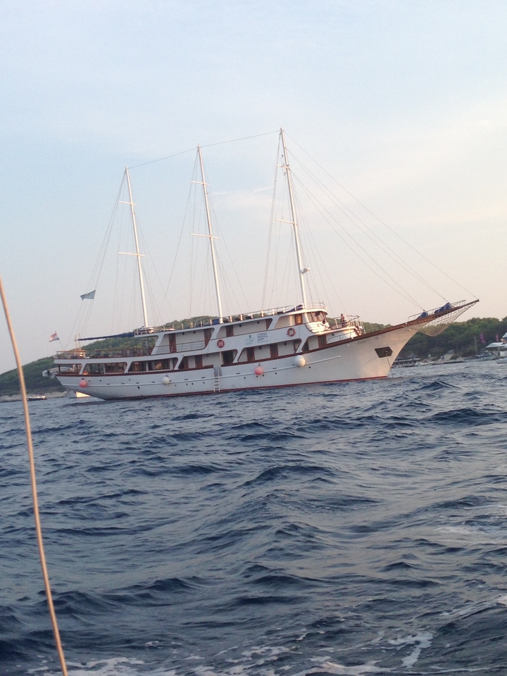 Large sailboat on the sea during dusk.