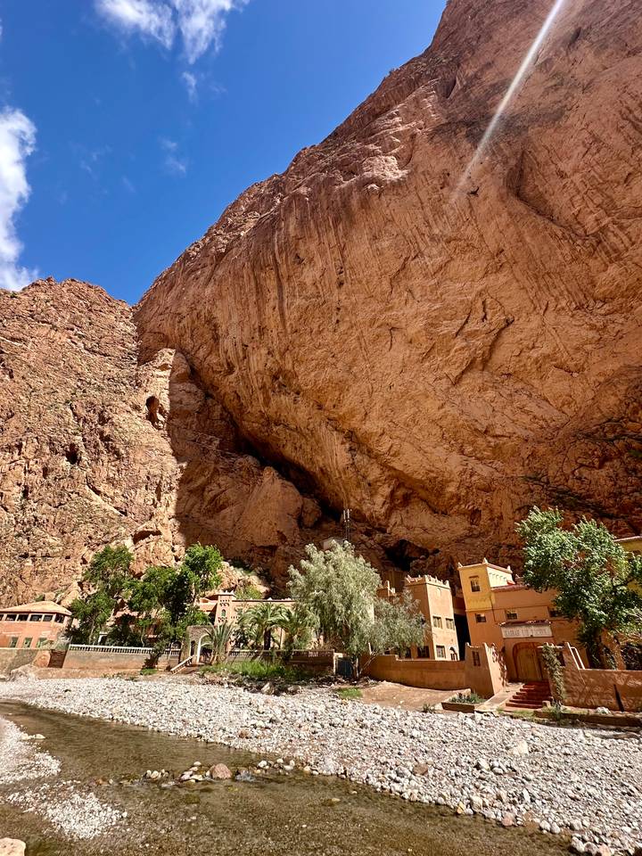 A gorge with steep rocky walls and a clear blue sky.