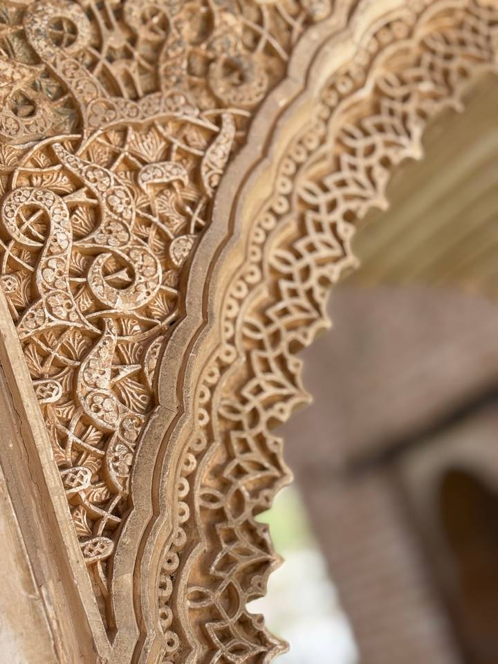 Intricate stone carving with floral patterns.