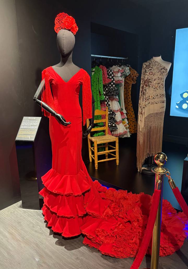 Exhibit of traditional flamenco dresses and fan.