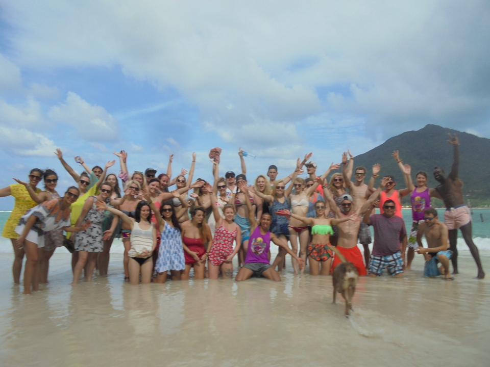 Large group enjoying themselves on a beach.