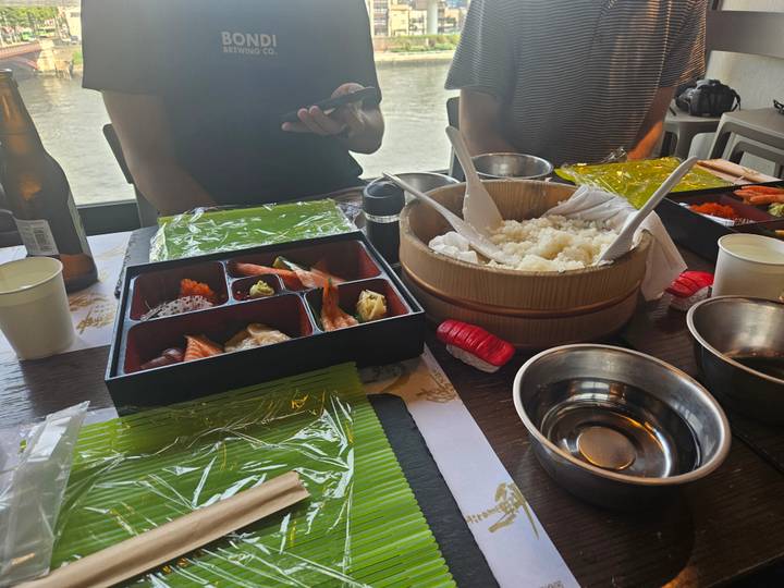 Traditional Japanese meal with various dishes on a table.
