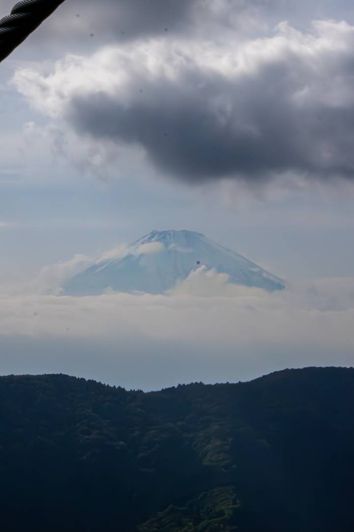 Mount Fuji partially obscured by clouds.