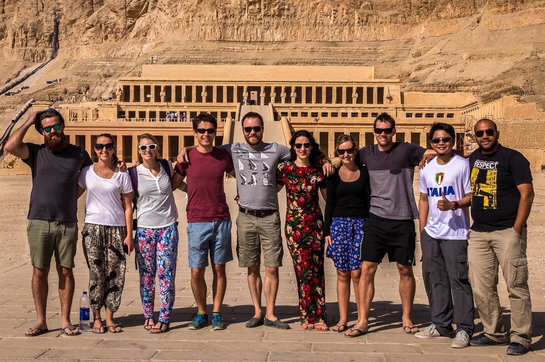 Group in front of an ancient temple complex.