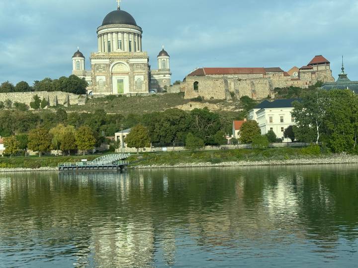 Historic building viewed from across the river
