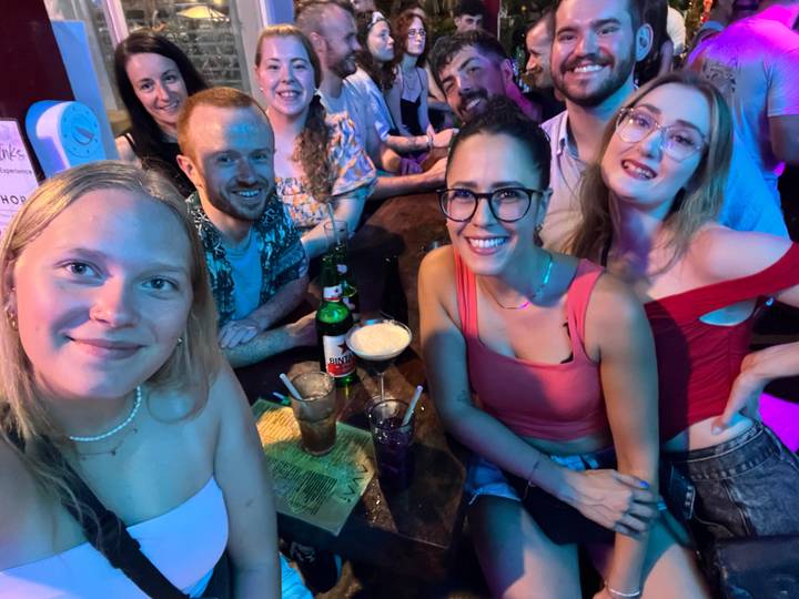 Group of friends enjoying drinks at a bar.