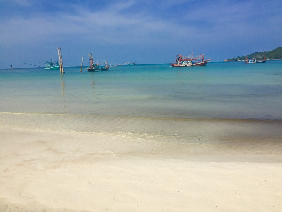 Idyllic beach with traditional fishing boats.