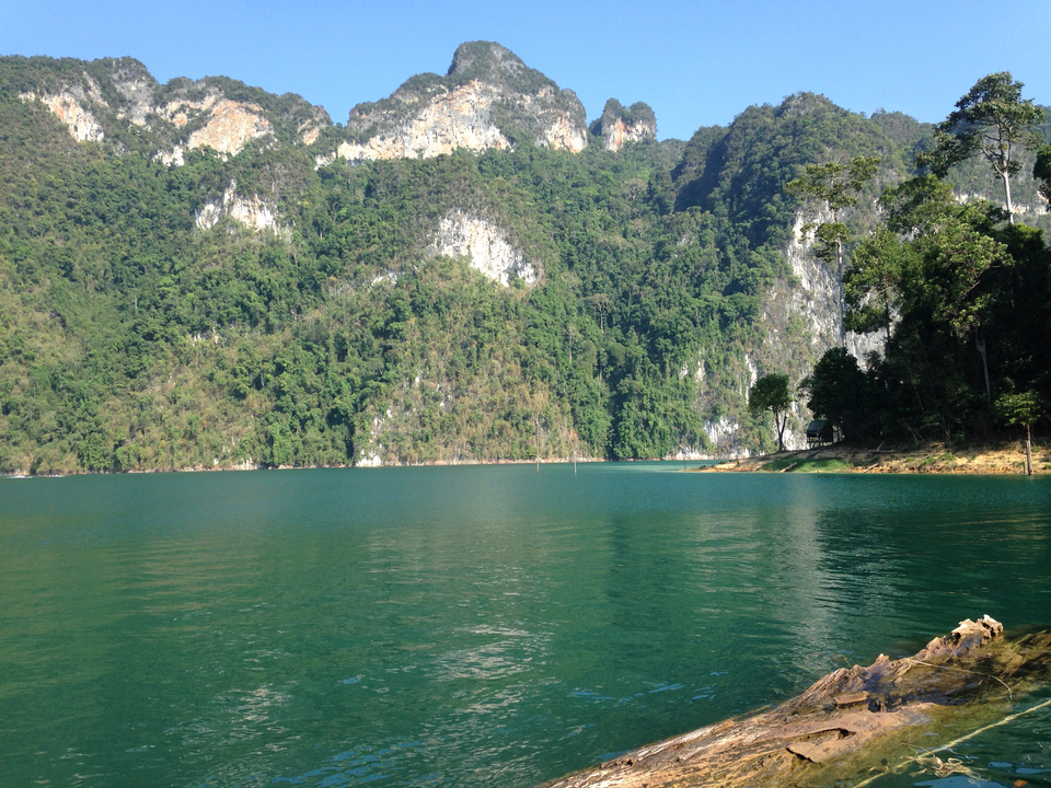 Tranquil lake surrounded by mountains.