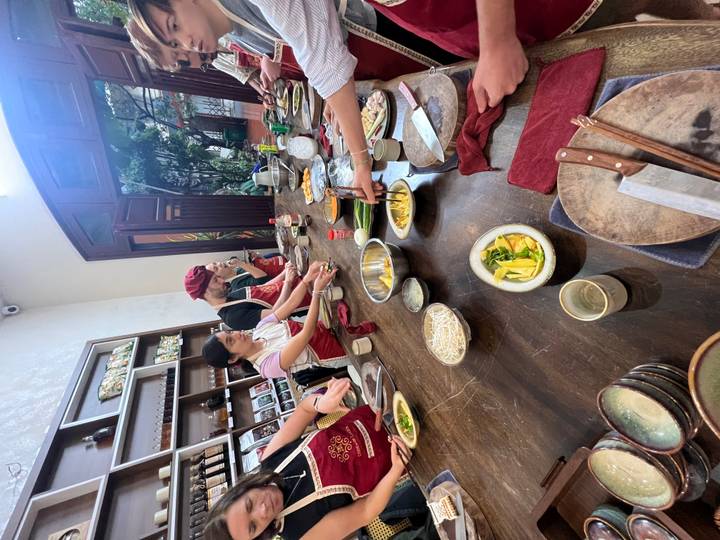 Cooking class with people preparing food.