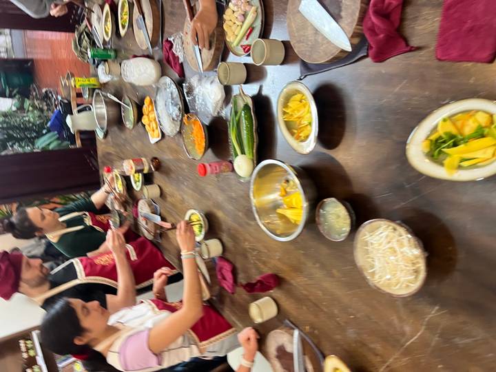 Blurred view of people in a cooking class.