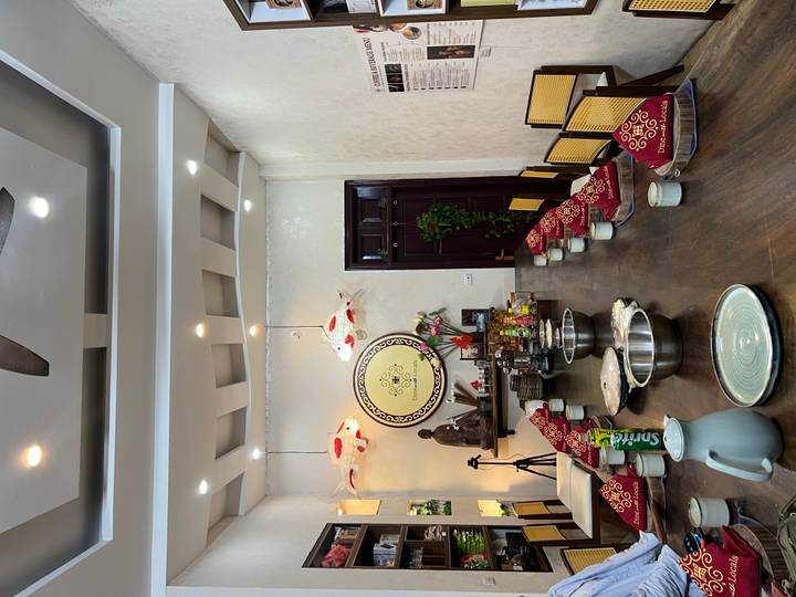 Empty dining table set up for a cooking class.