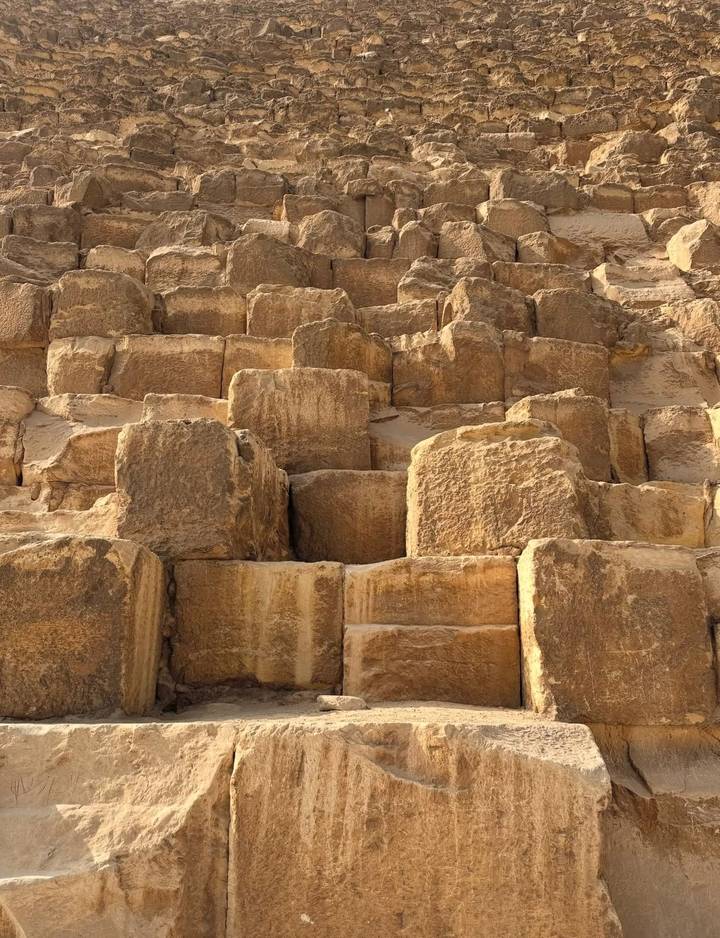Close-up of ancient stone blocks forming part of a pyramid.
