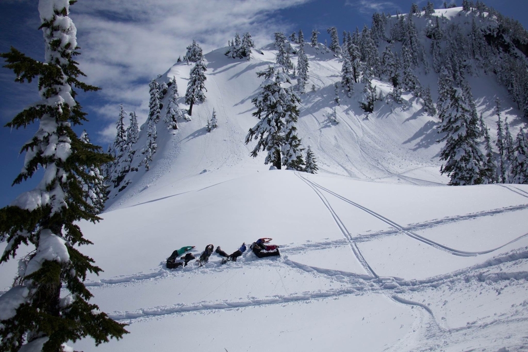 People enjoying the snow with different winter activities.