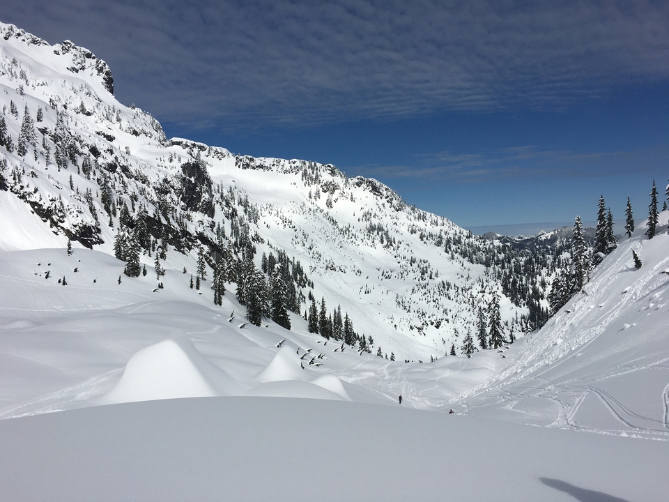 Snow-covered mountain landscape with a clear sky.