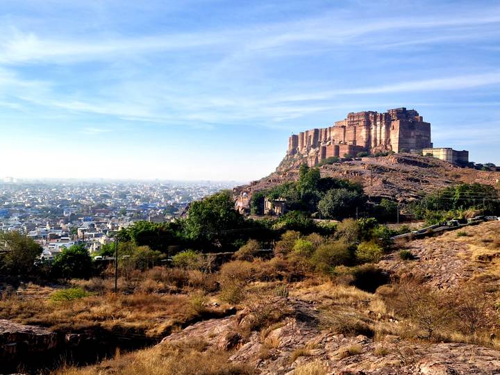 Mehrangarh Fort overlooking the cityscape of Jodhpur from a hill.