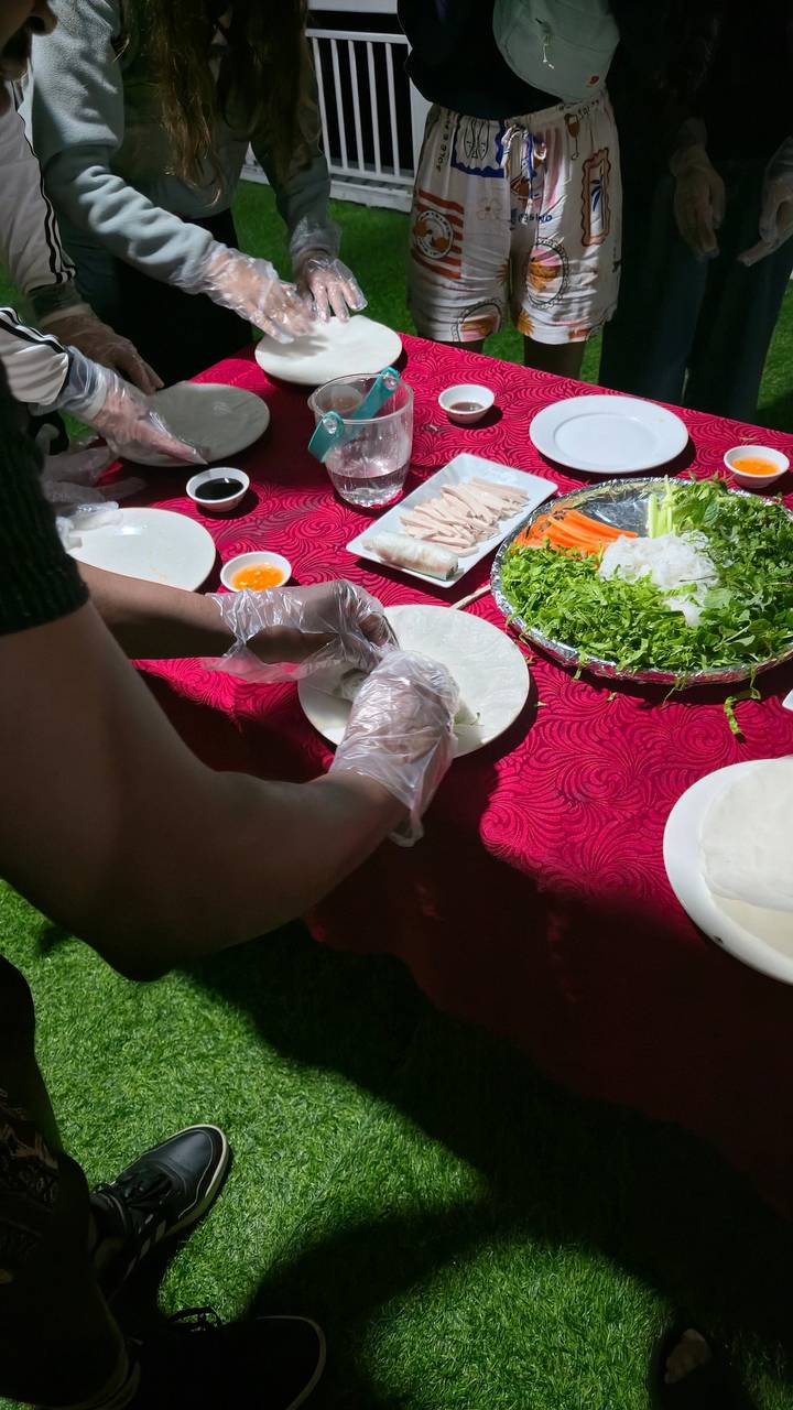 Person preparing food with fresh ingredients on a table.