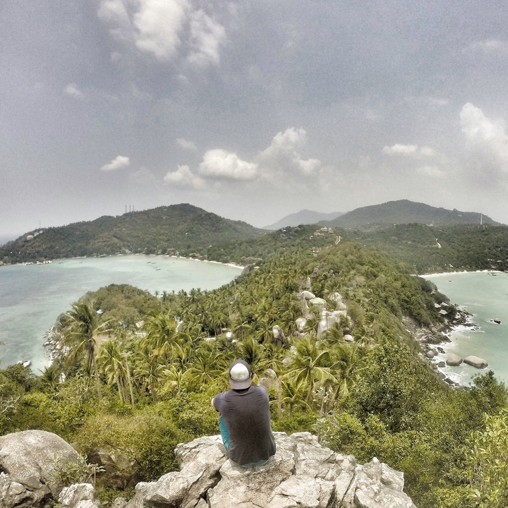 Panoramic view of a hilly tropical landscape.