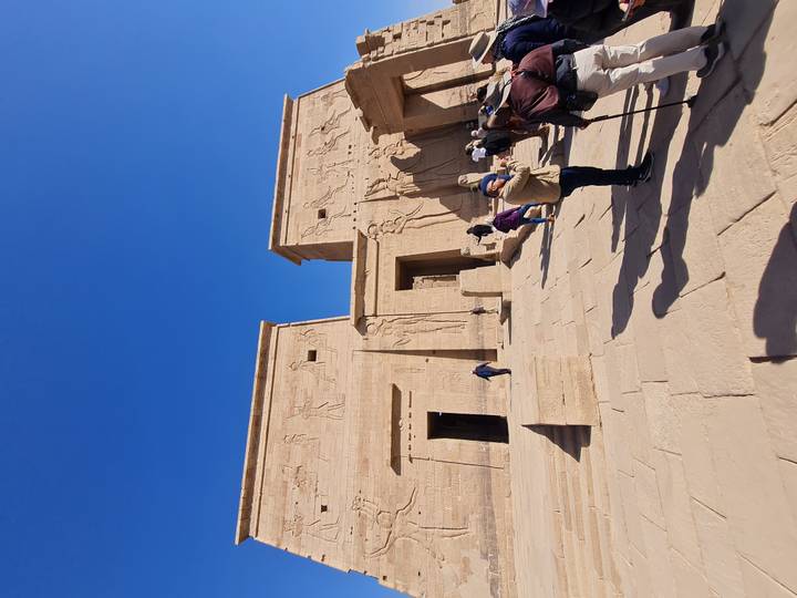 Ancient Egyptian ruins with tall, intricately carved walls.