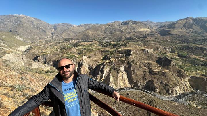 Man posing with a view of the canyon in the background.