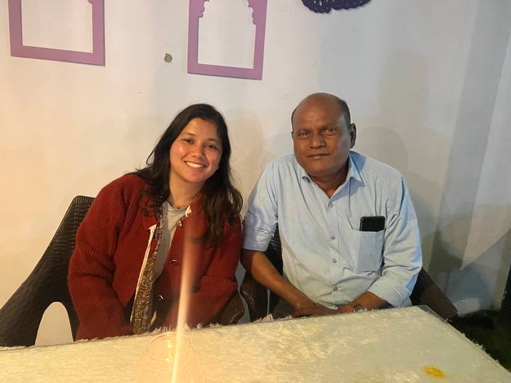 Two people sitting in a restaurant or cafe.