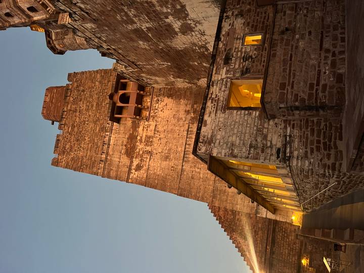 Brick fortress structure under evening light.