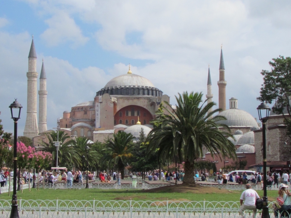 Hagia Sophia with a busy crowd and a clear sky.