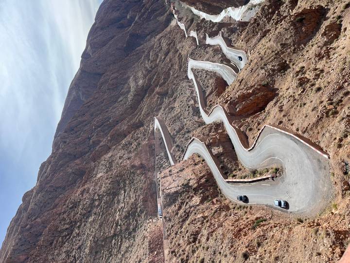 Scenic winding road through rugged mountain terrain.