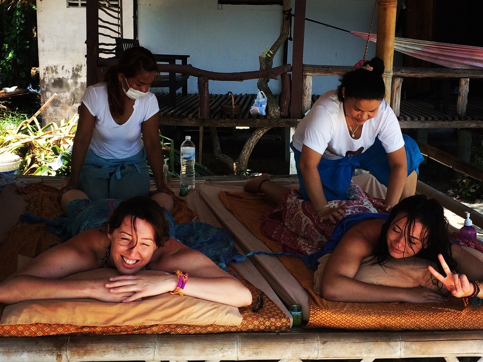 People receiving massages outdoors.