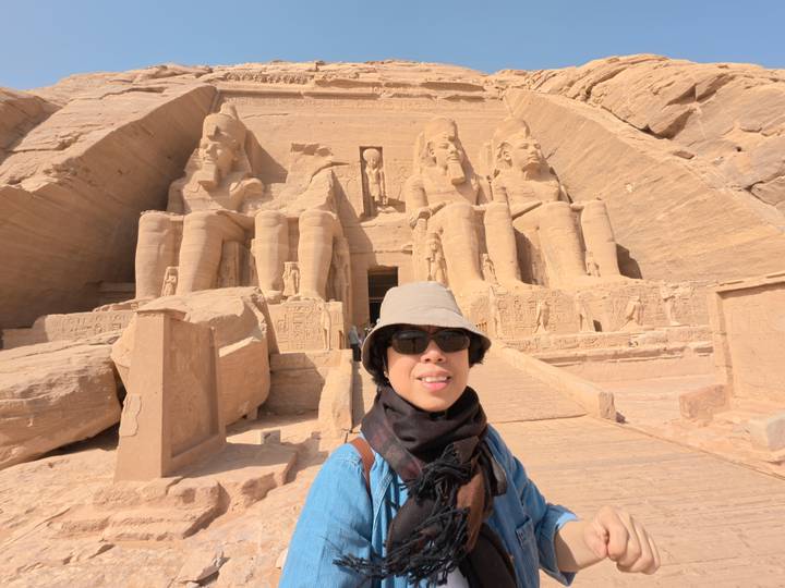 Person taking a selfie in front of the Abu Simbel temples.