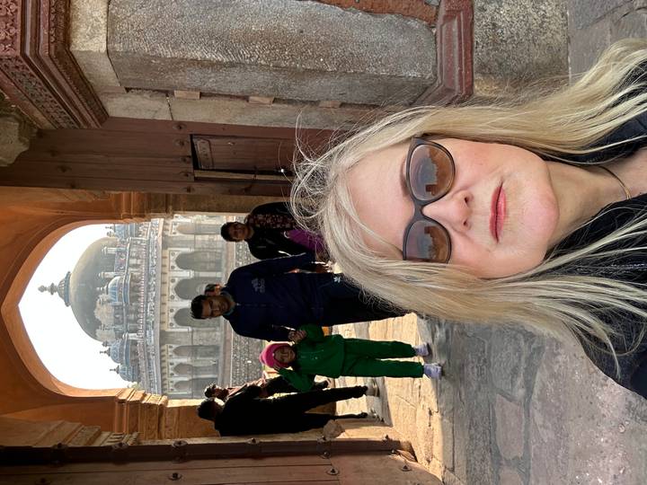 Tourists in front of historic architecture.
