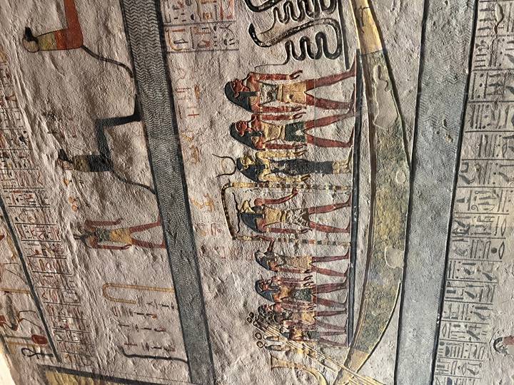 Ancient Egyptian paintings on a temple wall.