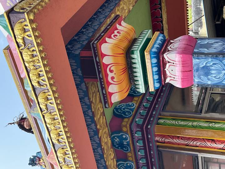 Close-up of a colorful and ornately decorated temple column.