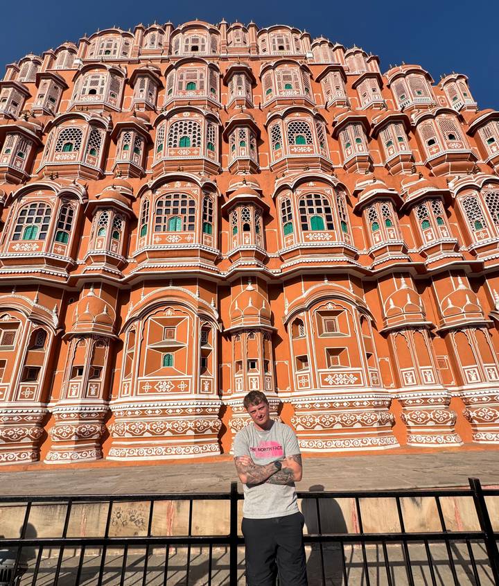 Person standing in front of Hawa Mahal, Jaipur.