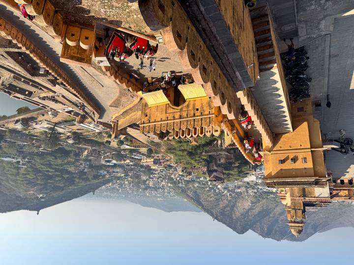 View from above of Amer Fort with hills in the background.