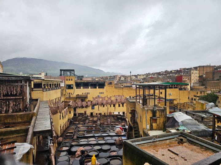 Panoramic view of the famous Chouara leather tannery with dyeing pits and hanging hides.