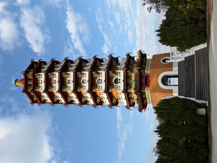 Elegant Ci'en Pagoda rises against a partly cloudy sky near Sun Moon Lake.