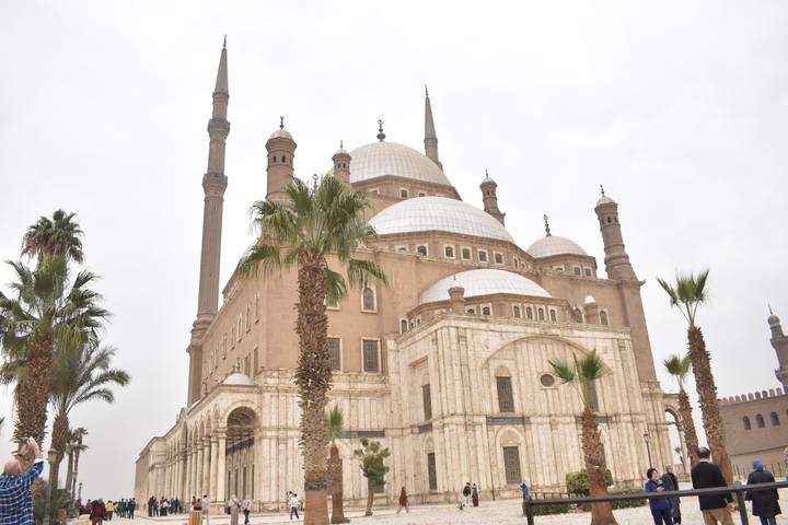 The grand Muhammad Ali Mosque with soaring minarets framed by palms.