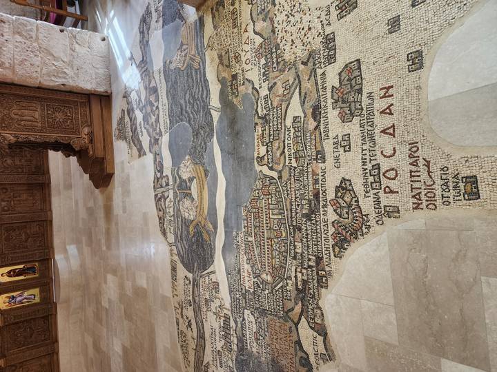 Ancient mosaic floor map depicting biblical geography inside a historic church in Madaba