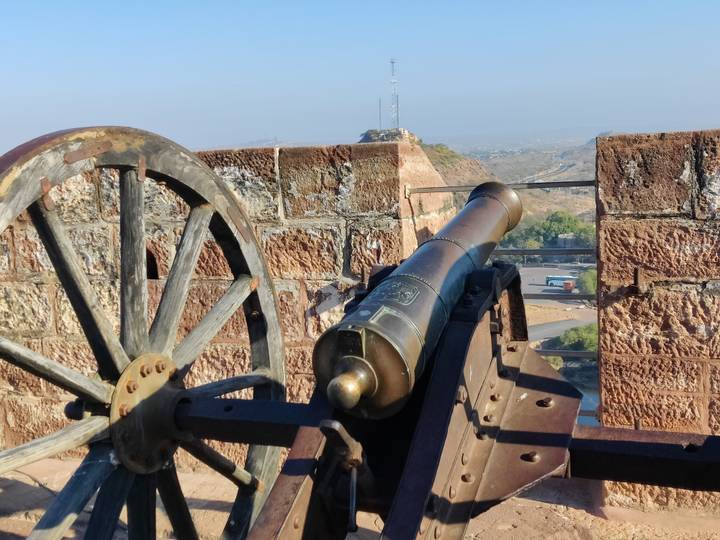 Historic cannon positioned on ramparts overlooking arid landscape outside Jodhpur