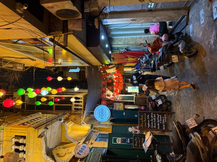 Bright multicolored lantern street in Hanoi’s Old Quarter bustling with evening activity (duplicate scene).