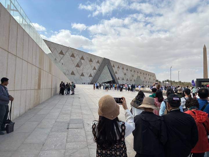 Queue of visitors outside the striking modern façade of Egypt’s Grand Museum in Cairo