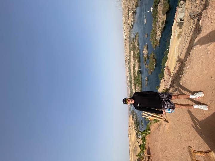 Repeat image of traveler overlooking the Nile River from a desert bluff.