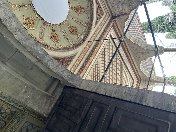 Decorative Ottoman archway and patterned ceiling inside Topkapi Palace.