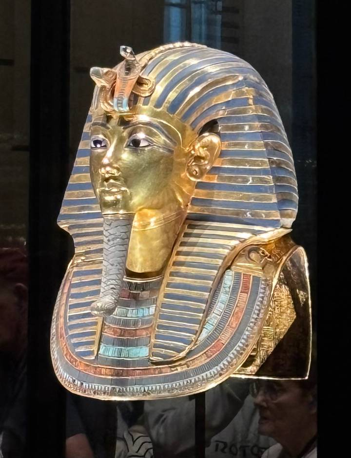 Golden funerary mask of Pharaoh Tutankhamun displayed in the Egyptian Museum.