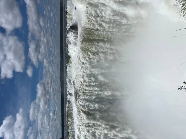 Powerful Devil’s Throat section of Iguazu Falls plunging into a cloud of white mist.