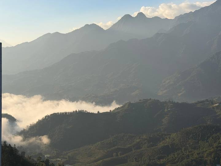 Misty mountain valleys with layers of peaks and morning fog, Sapa region.